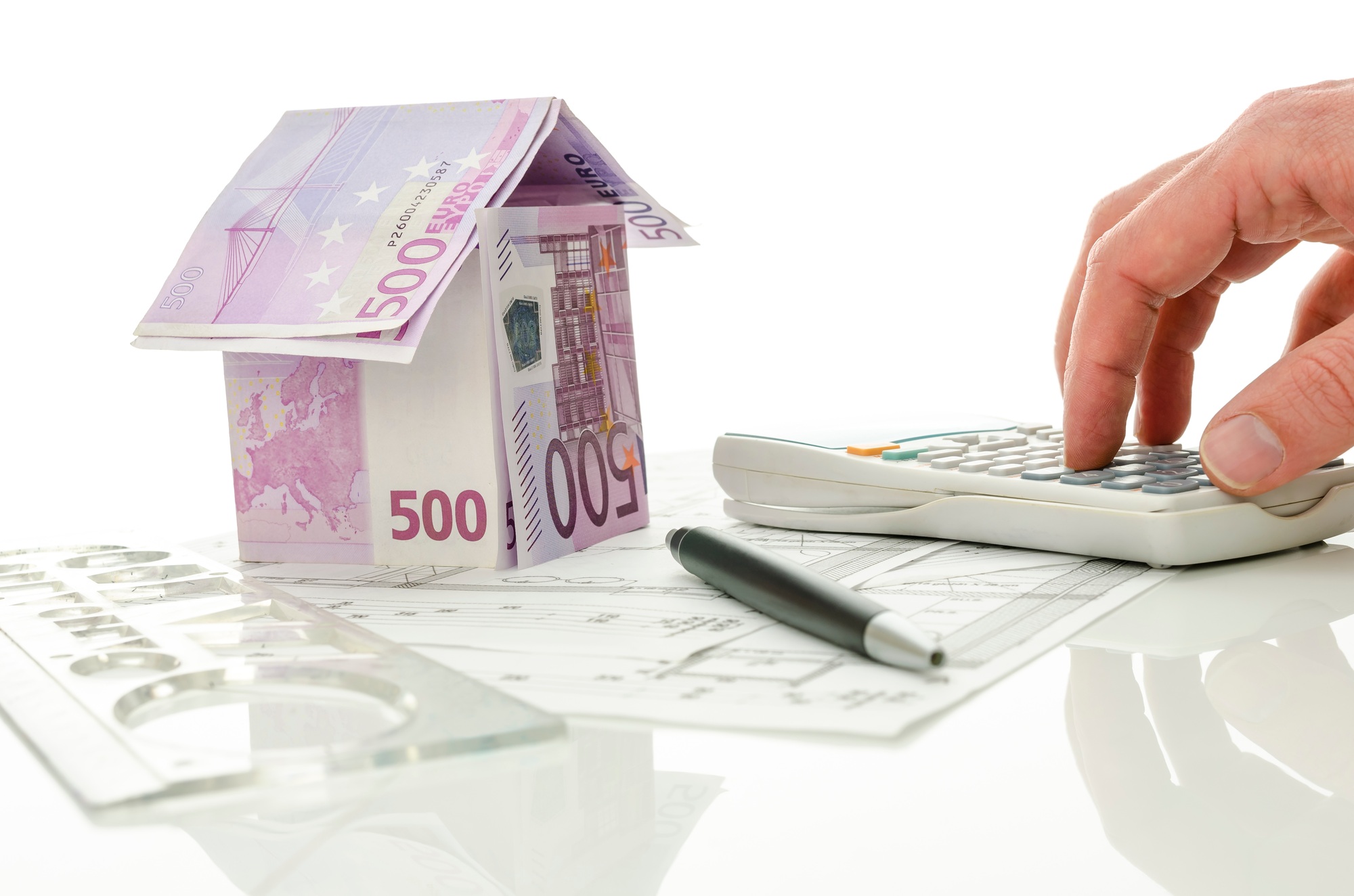 Architect calculating costs of house construction