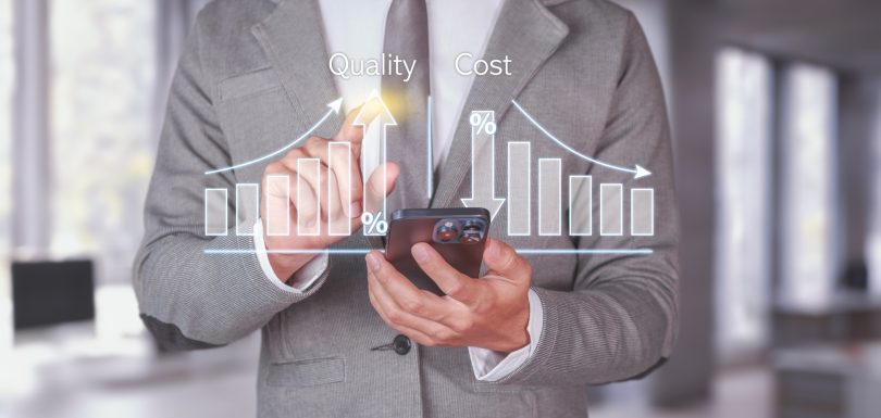 Quality and Cost Analysis. Businessman using smartphone with quality improvement and cost reduction.