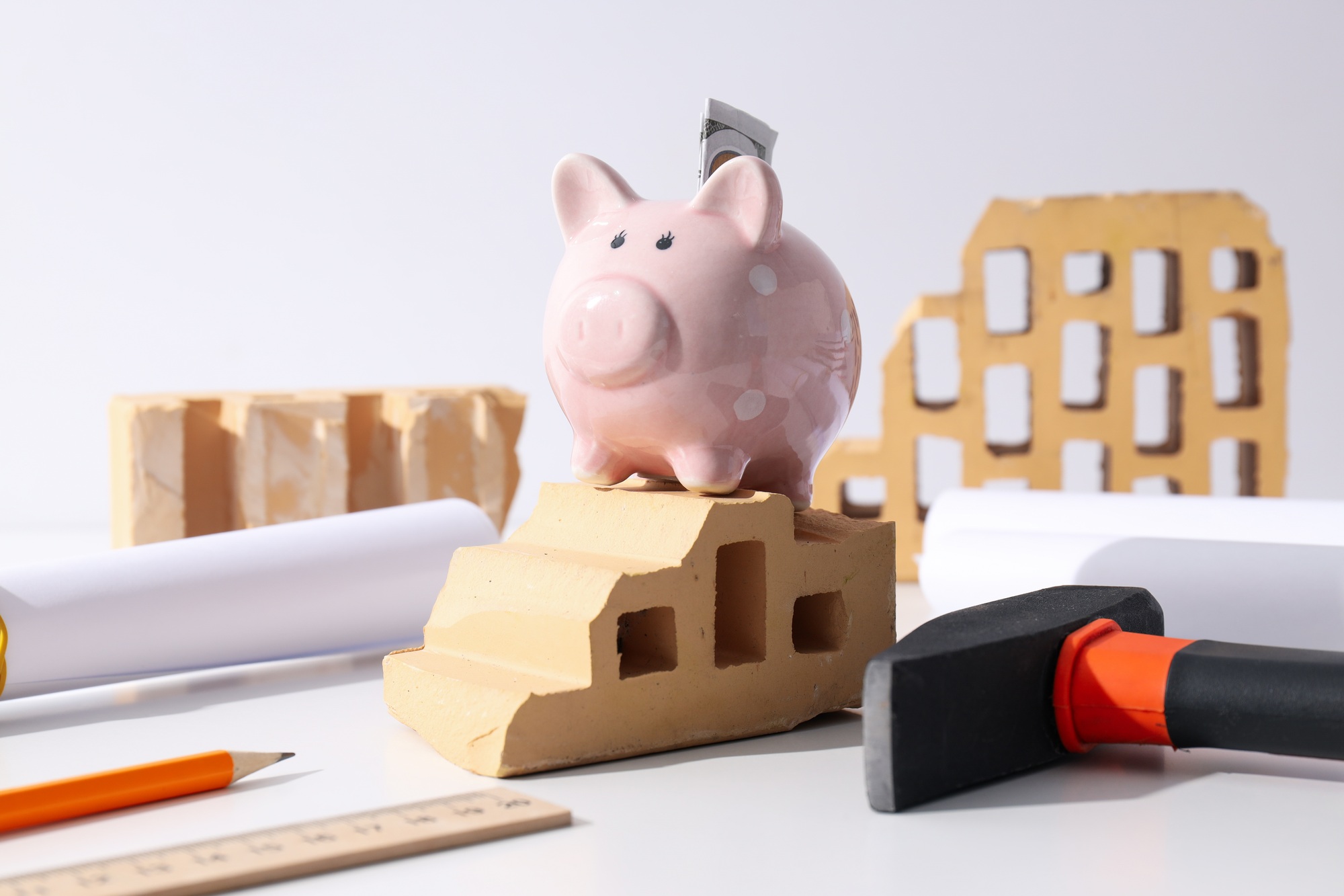 The concept of designing a house, investing in real estate, saving.
