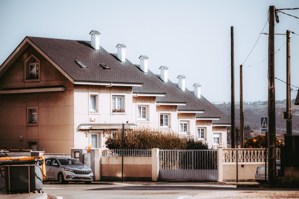 Townhouse with chimneys, gated fence